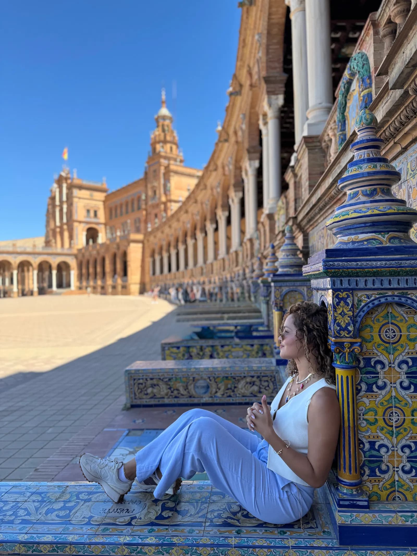 Woman seated in Plaza de España in Seville