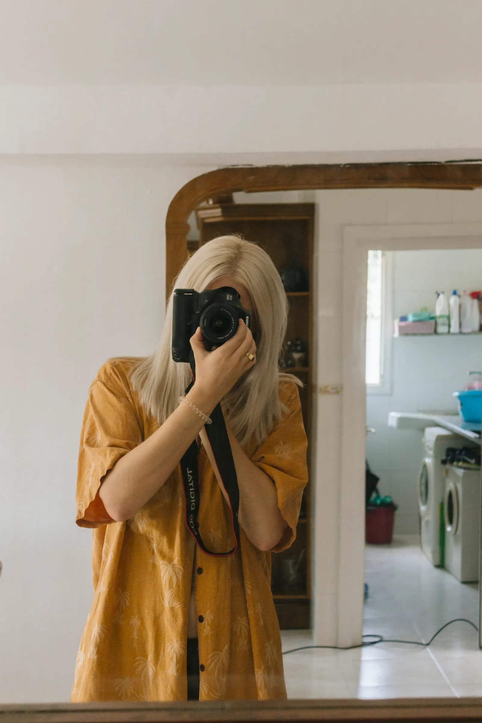 Woman taking a casual mirror selfie