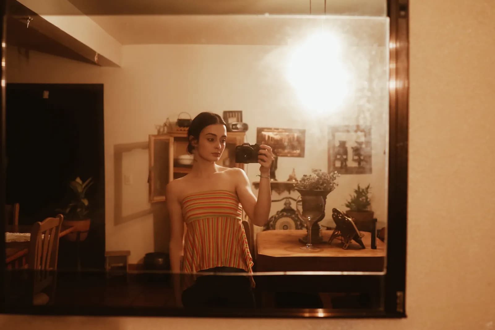 Woman taking an everyday reference photo in a mirror